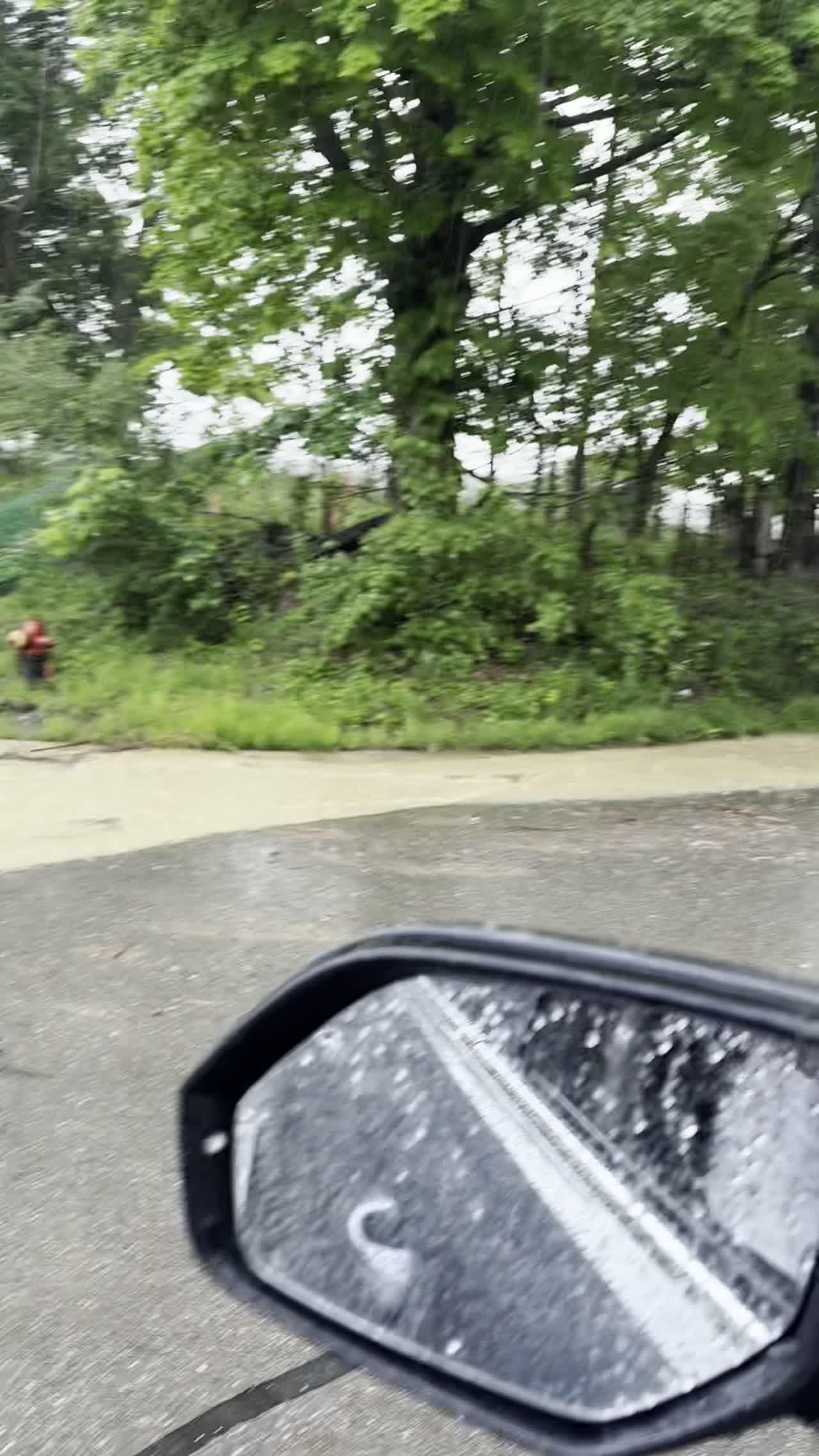 Dirty water sheeting across the road