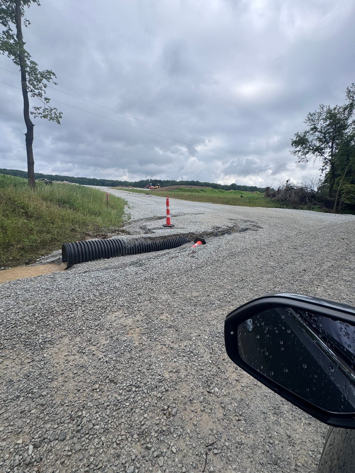 The site’s “drainage structure” — a corrugated pipe laid on top of the gravel.