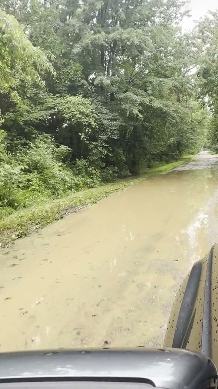 Kluver Road’s gravel surface completely underwater during a single storm — the streets are not adequate.